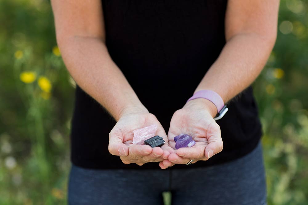 Close up of a woman's hands holding crystals